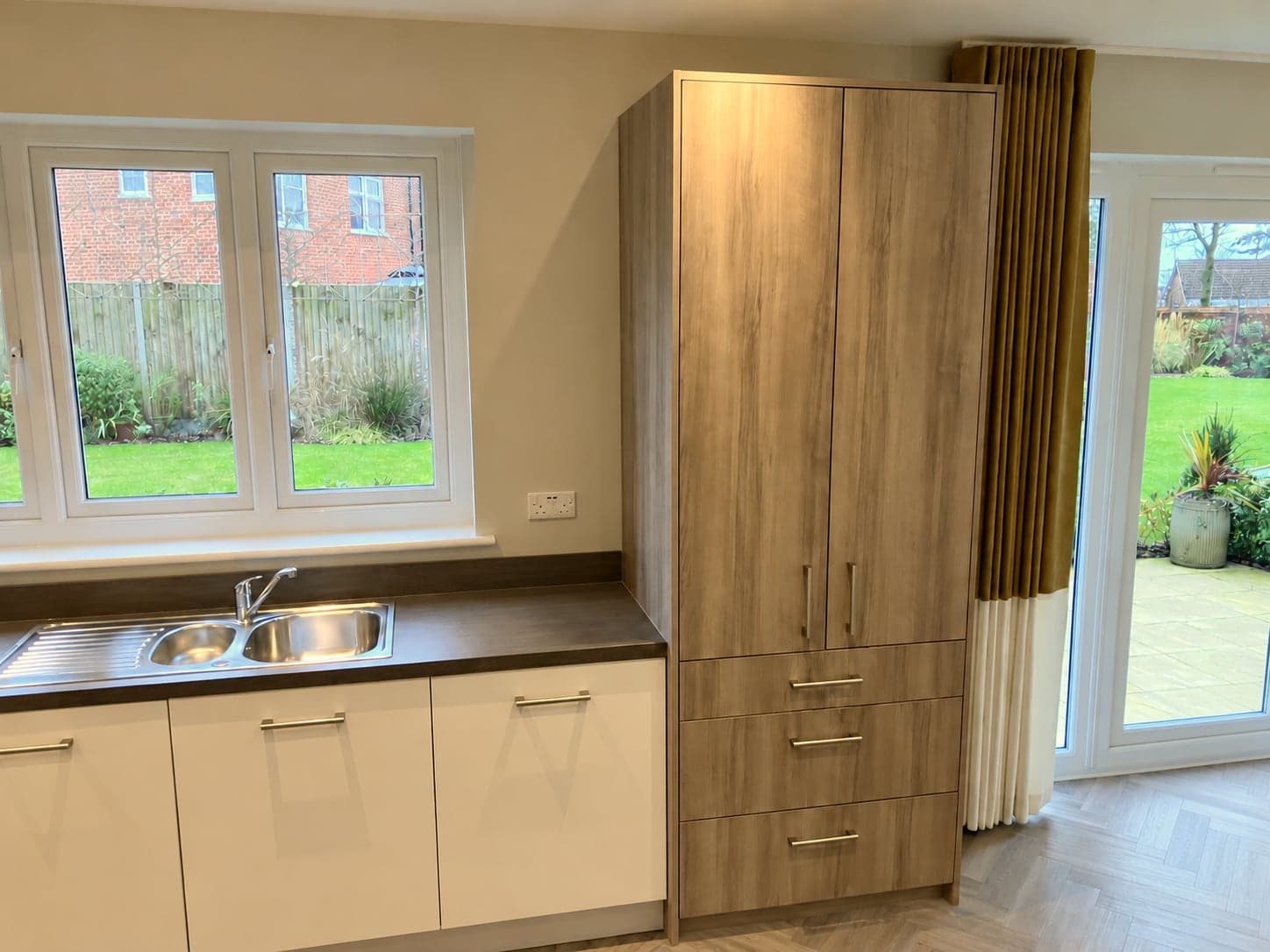Sink run and tall larder units beside the garden doors, St Albans AL1