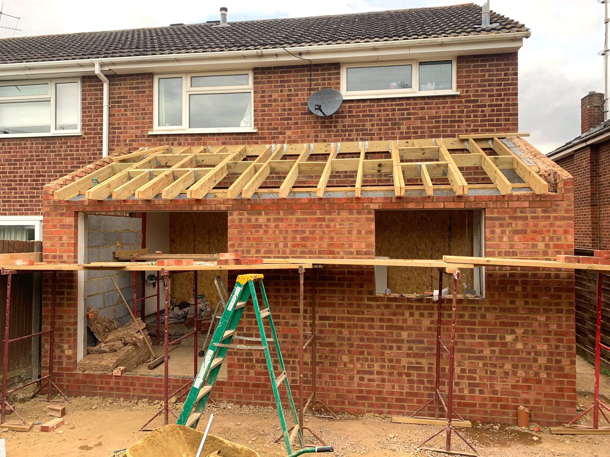Timber roof joists spanning the new extension, walls up to plate level, Borehamwood WD6