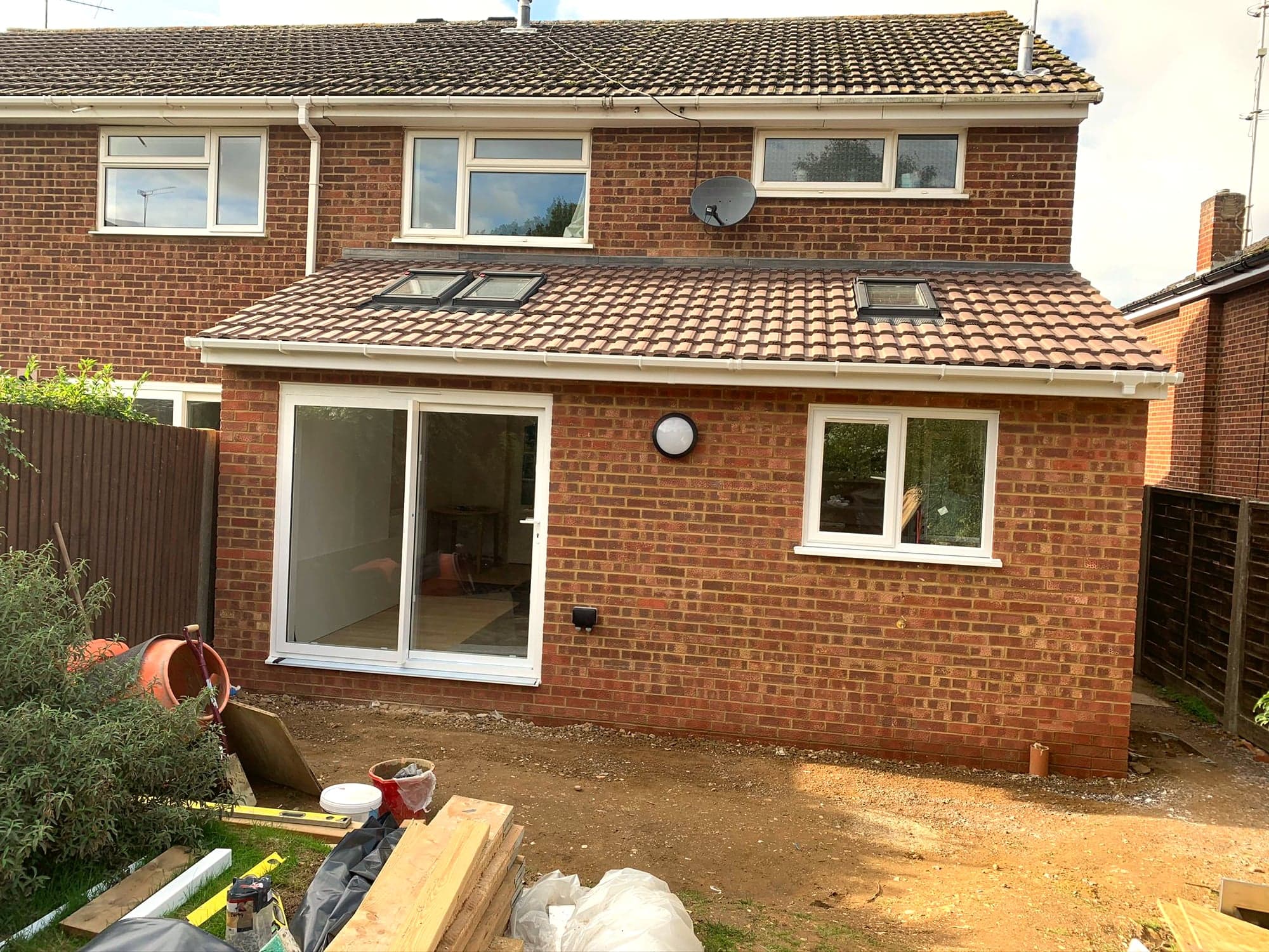 Extension brickwork complete with the new window and door openings formed, Borehamwood WD6