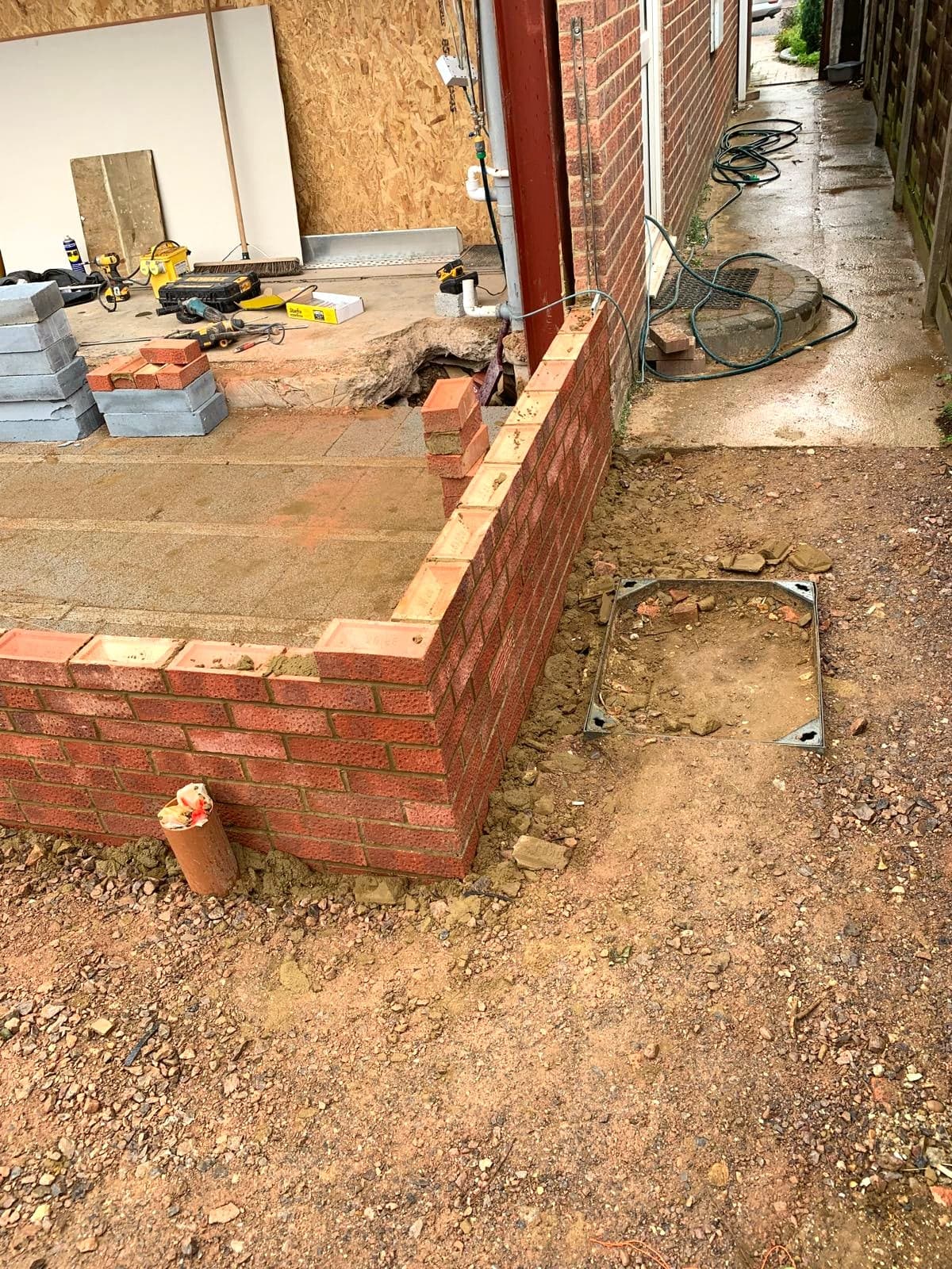 Corner of the new brickwork with services run through the slab, Borehamwood WD6