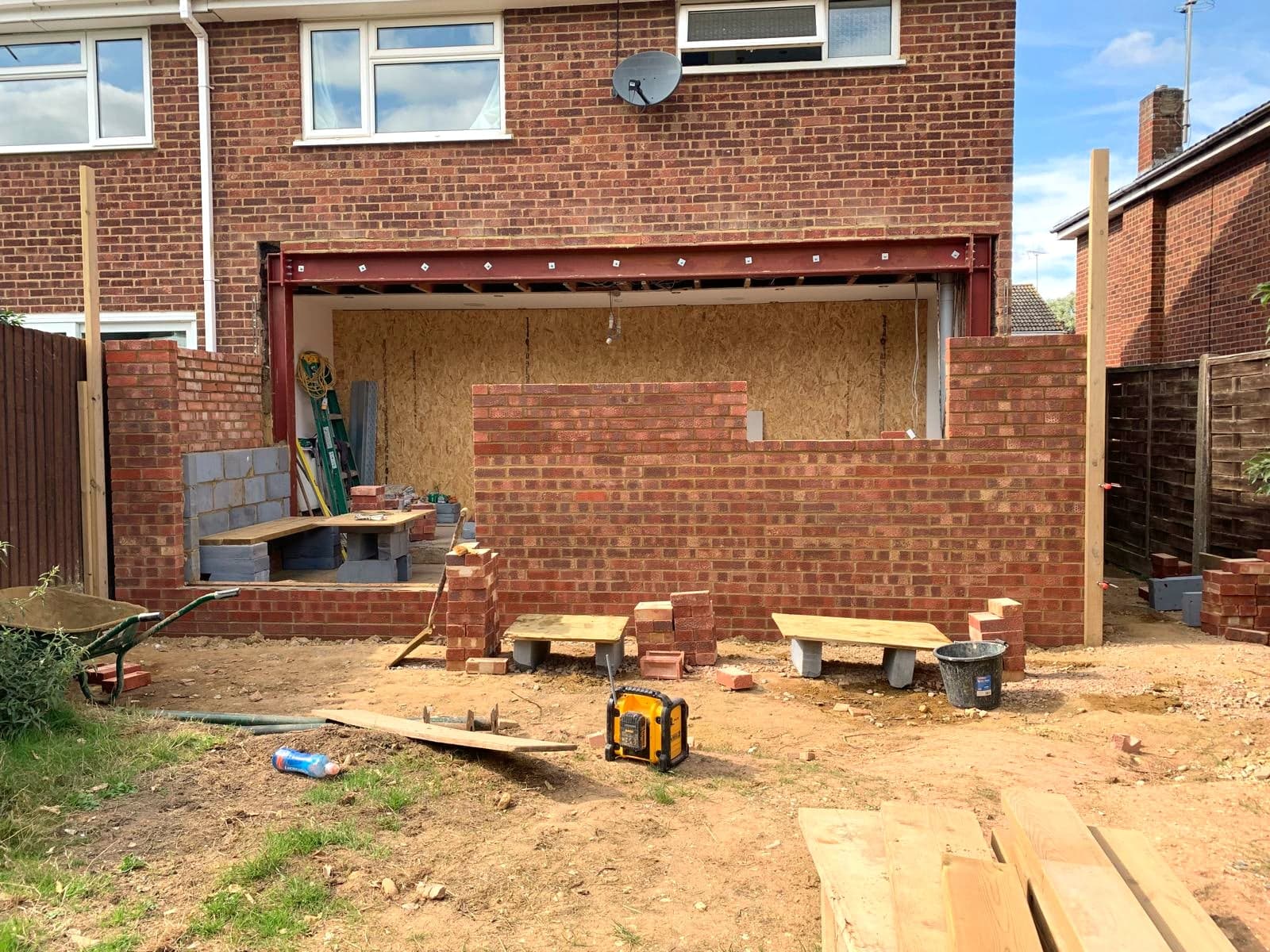 Cavity wall under construction with the steel over the rear opening, Borehamwood WD6