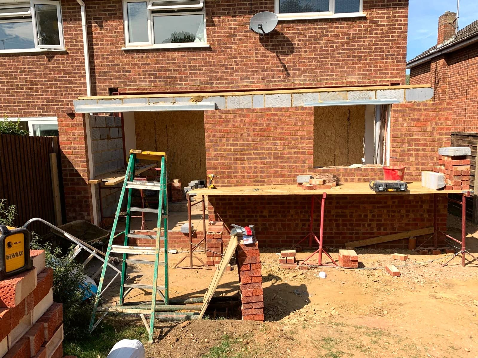 Rear elevation mid-build, steelwork in and brickwork progressing, Borehamwood WD6