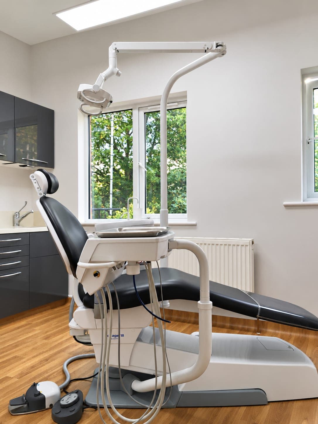Dental chair and overhead light beside the new window and radiator, Winchmore Hill N21