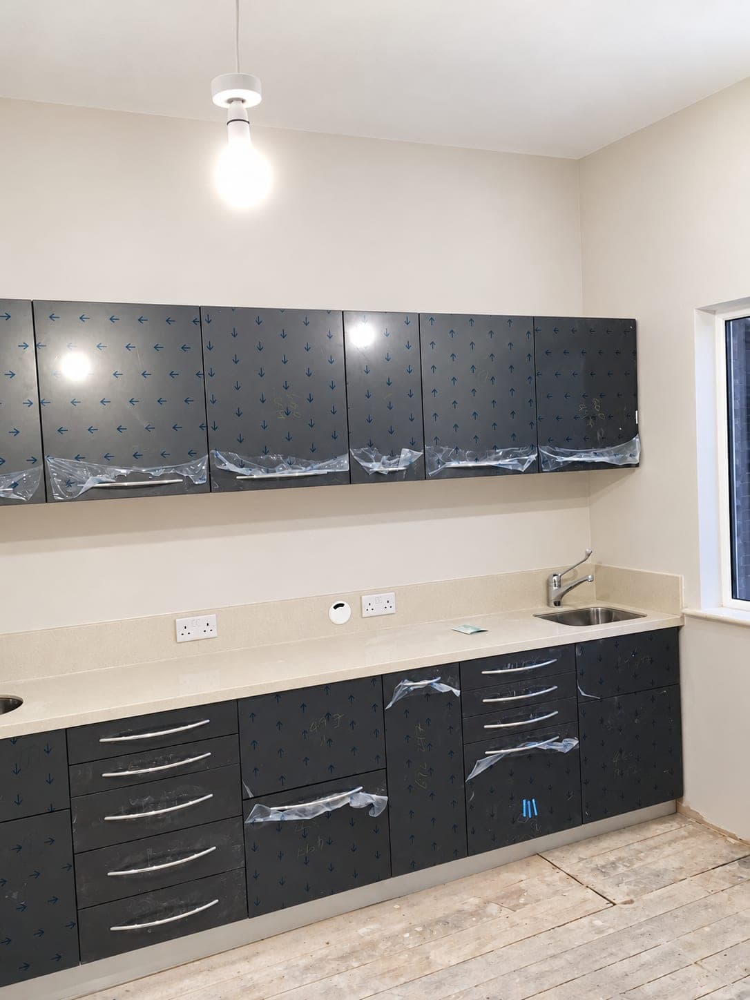 New cabinetry installed and still protected, sink and worktop run complete, Winchmore Hill N21