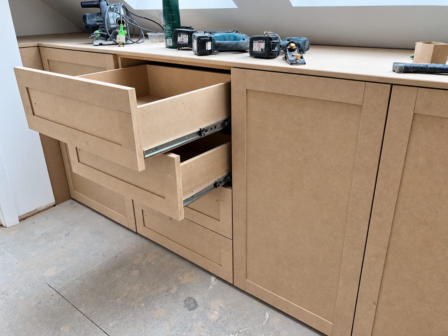 Drawer runners fitted to a bespoke carcass on site, London