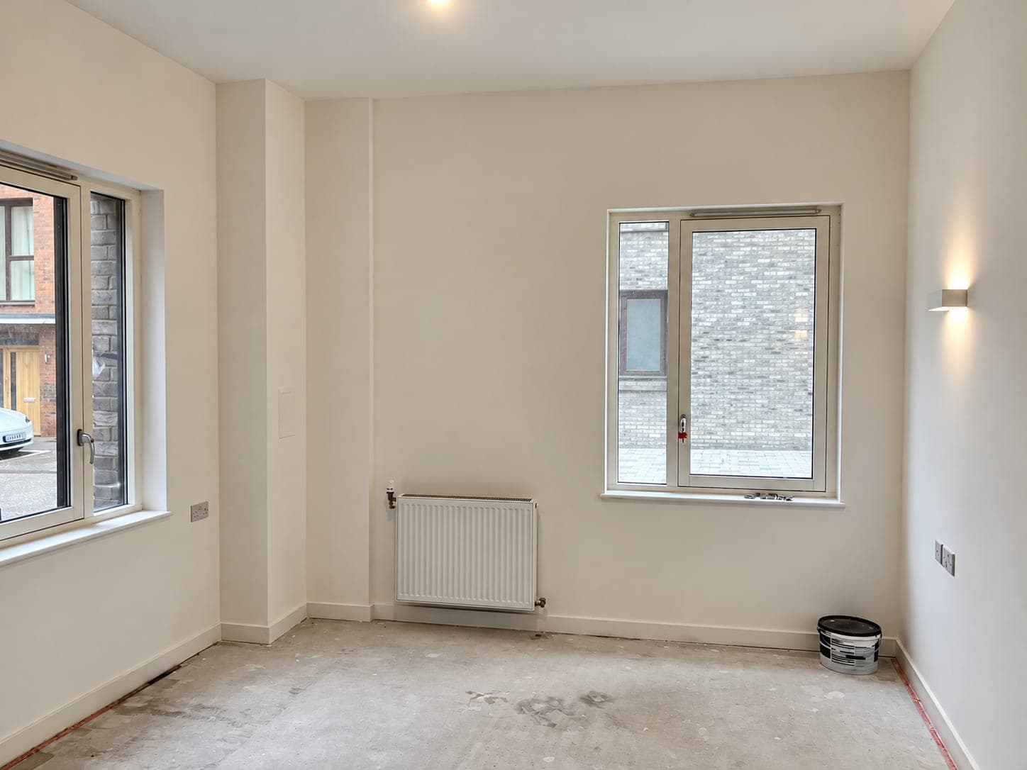 Finished dry wall with the radiator refitted under the window, London