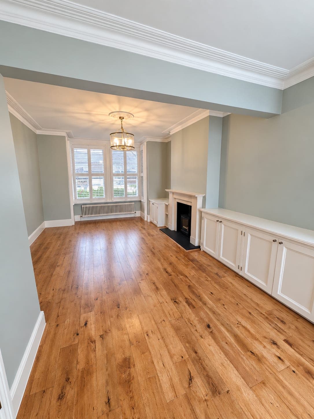 Oak flooring laid across a double reception room, London