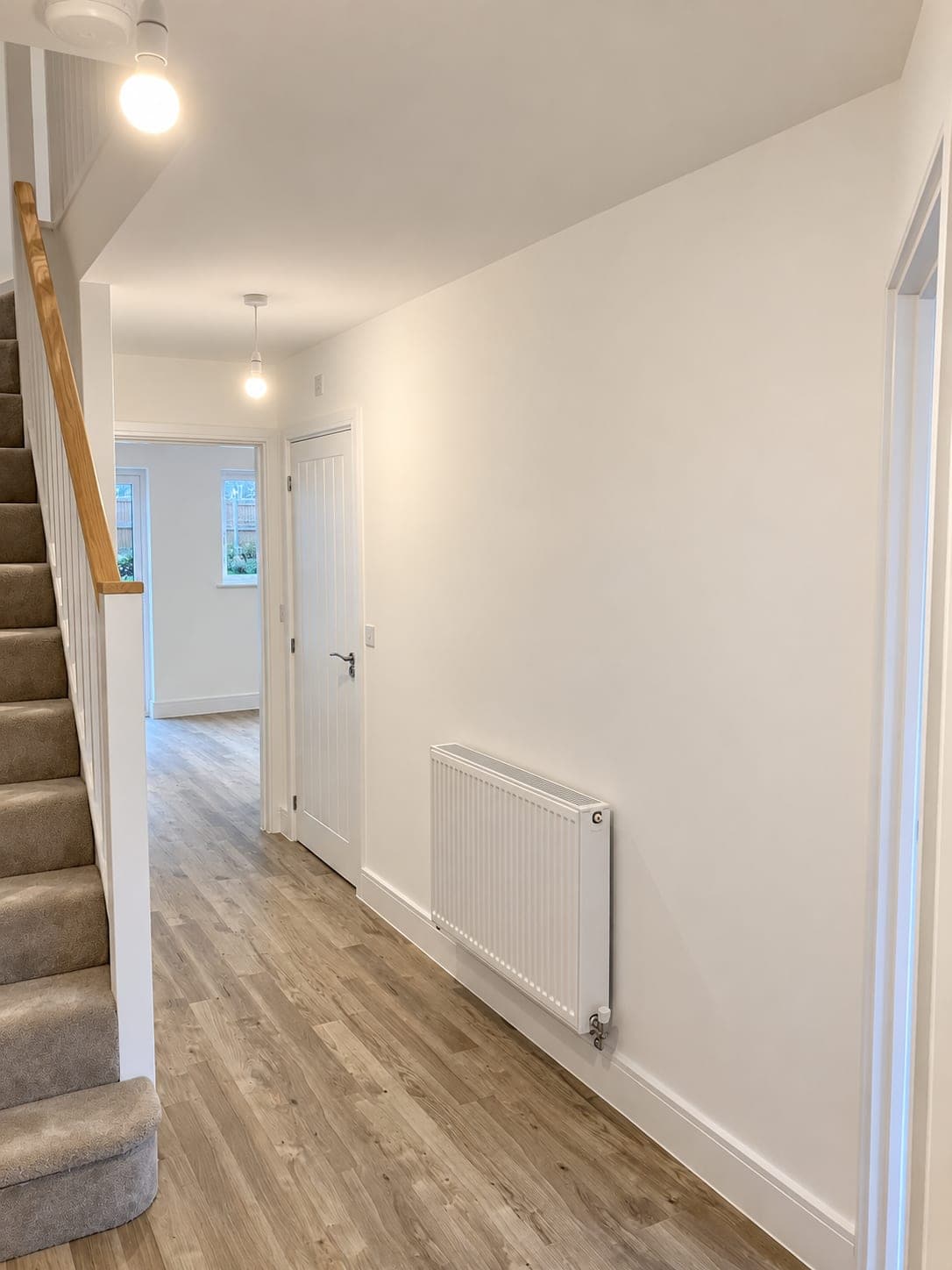 Plank flooring laid along a corridor, London
