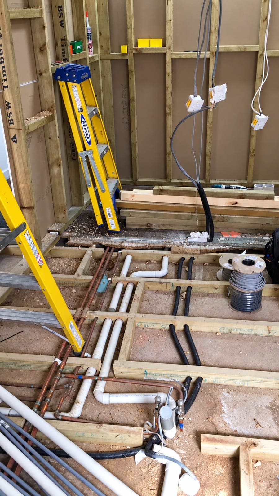 First-fix pipework run through the floor joists, London