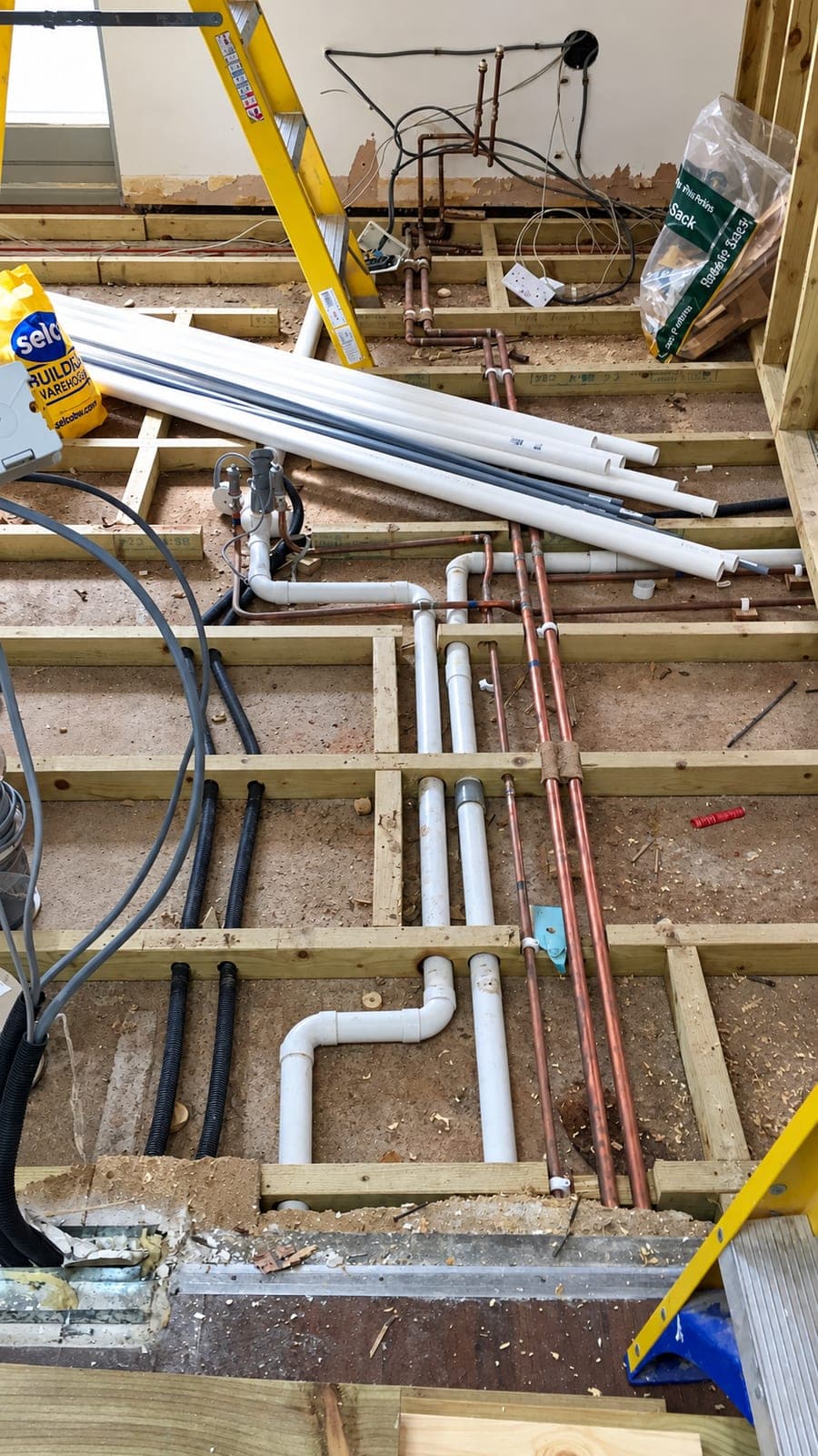 Waste and supply pipework taken through the floor deck, London