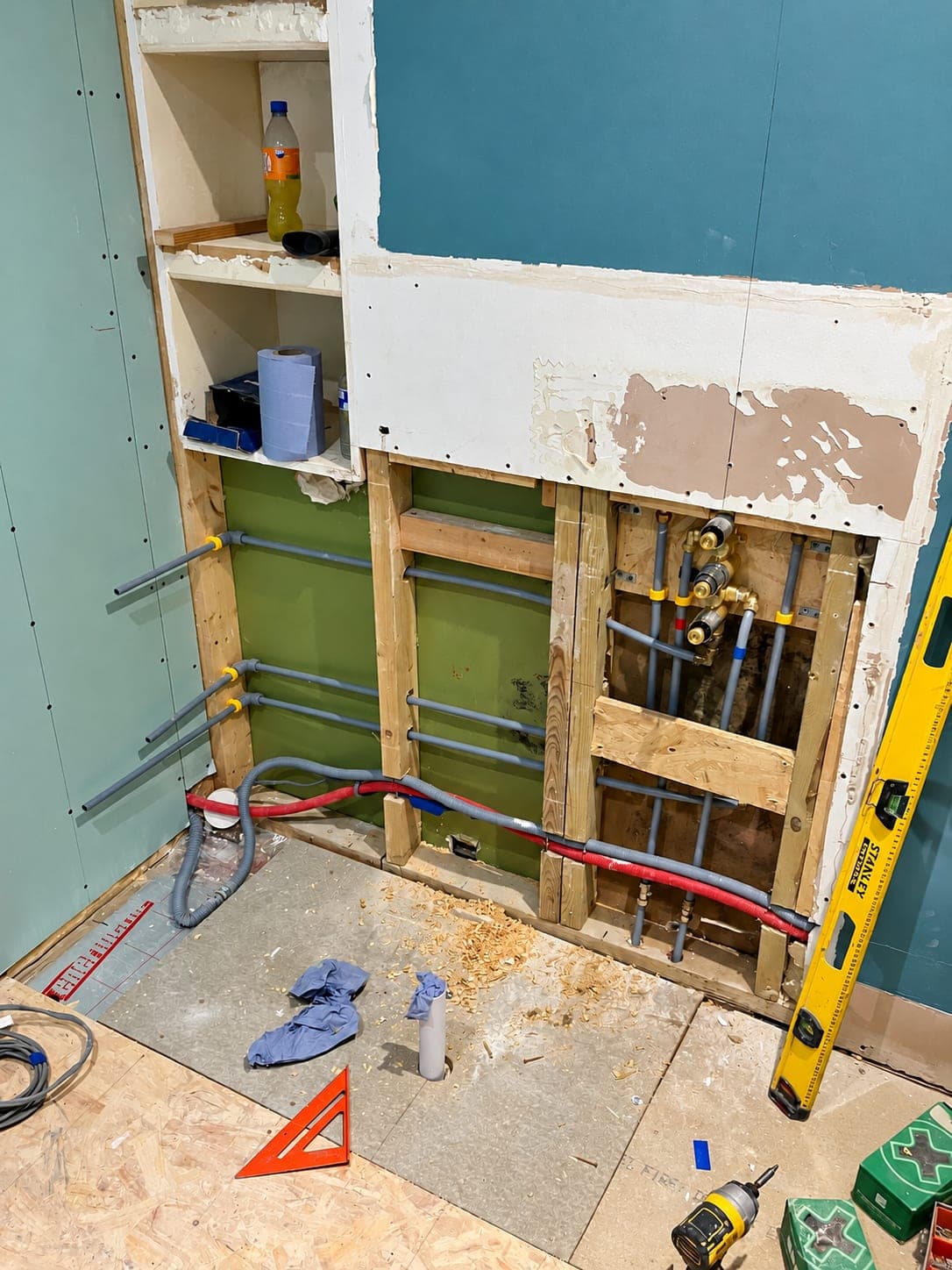 Pipework manifold and valve set made up on a stud wall, London