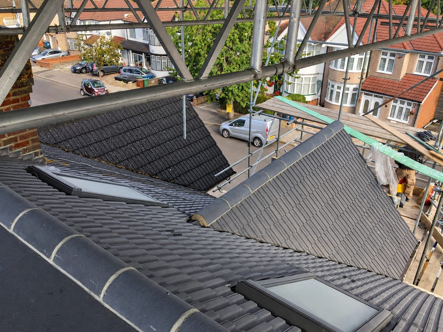 Newly tiled pitched roof with rooflights set into the slope, London