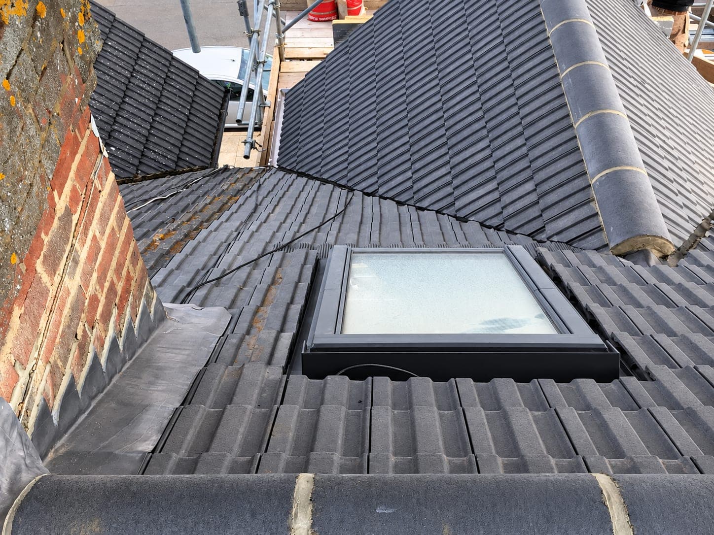 Tiled roof finished at the ridge and against the party wall, London