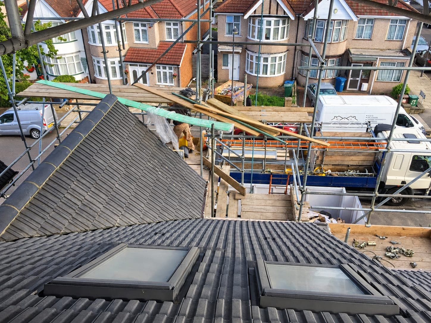 Twin rooflights fitted into a re-tiled roof slope, London
