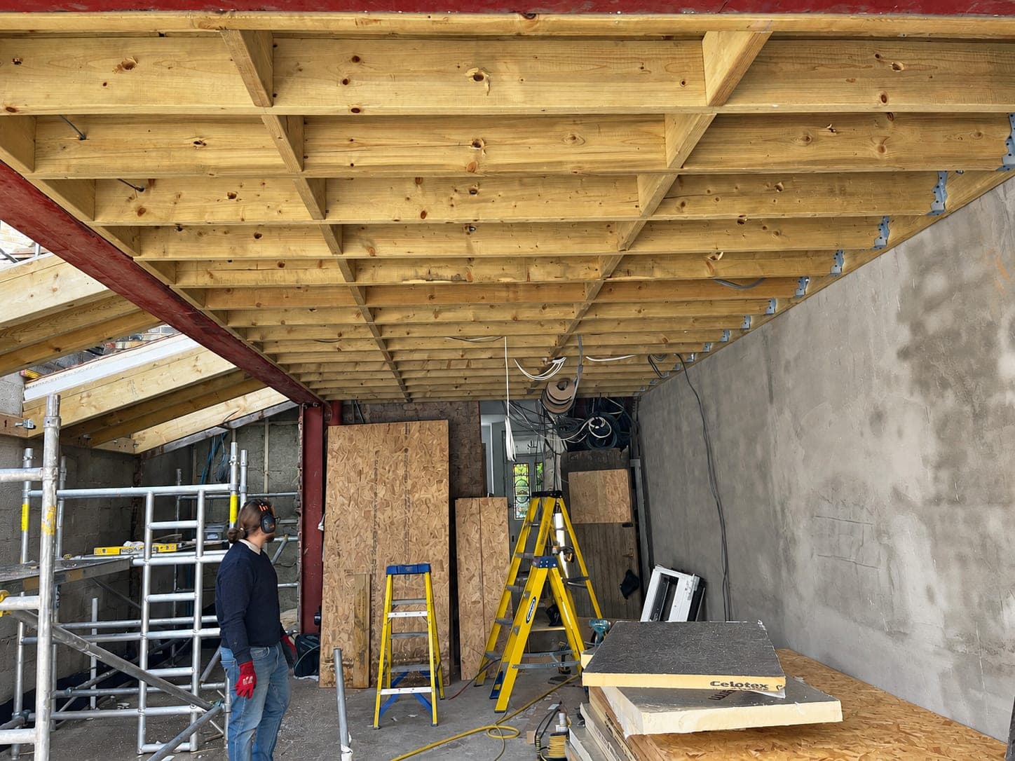 New timber floor joists hung off a steel beam, London