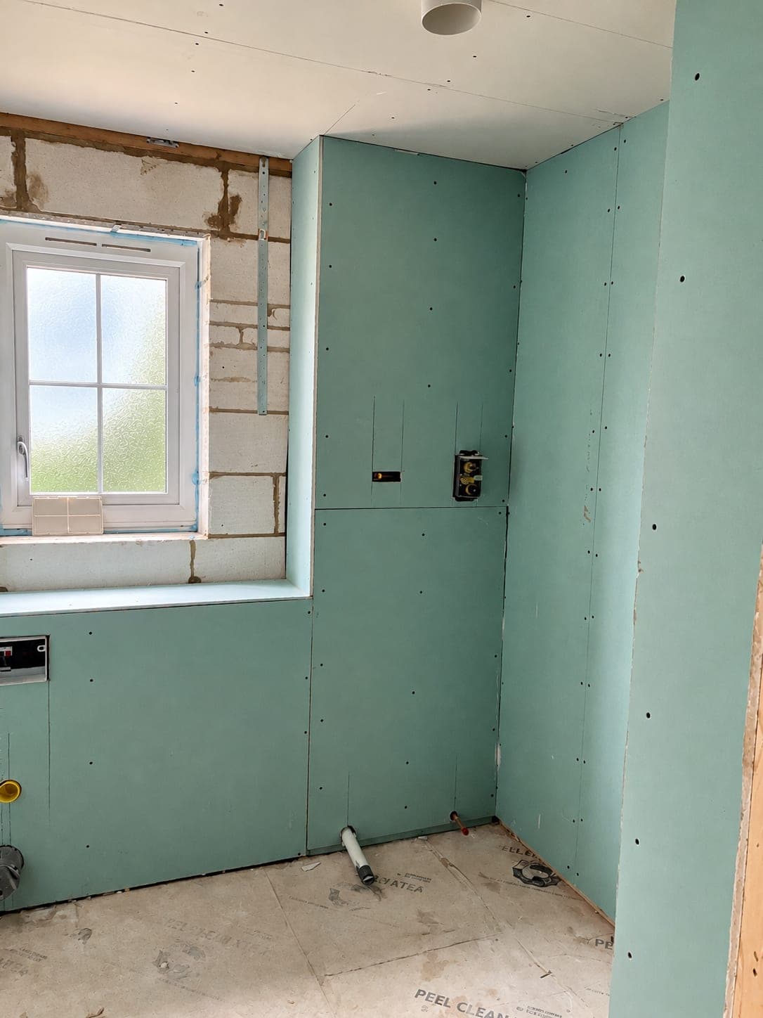 Moisture-resistant board fixed to partitions in a bathroom, London