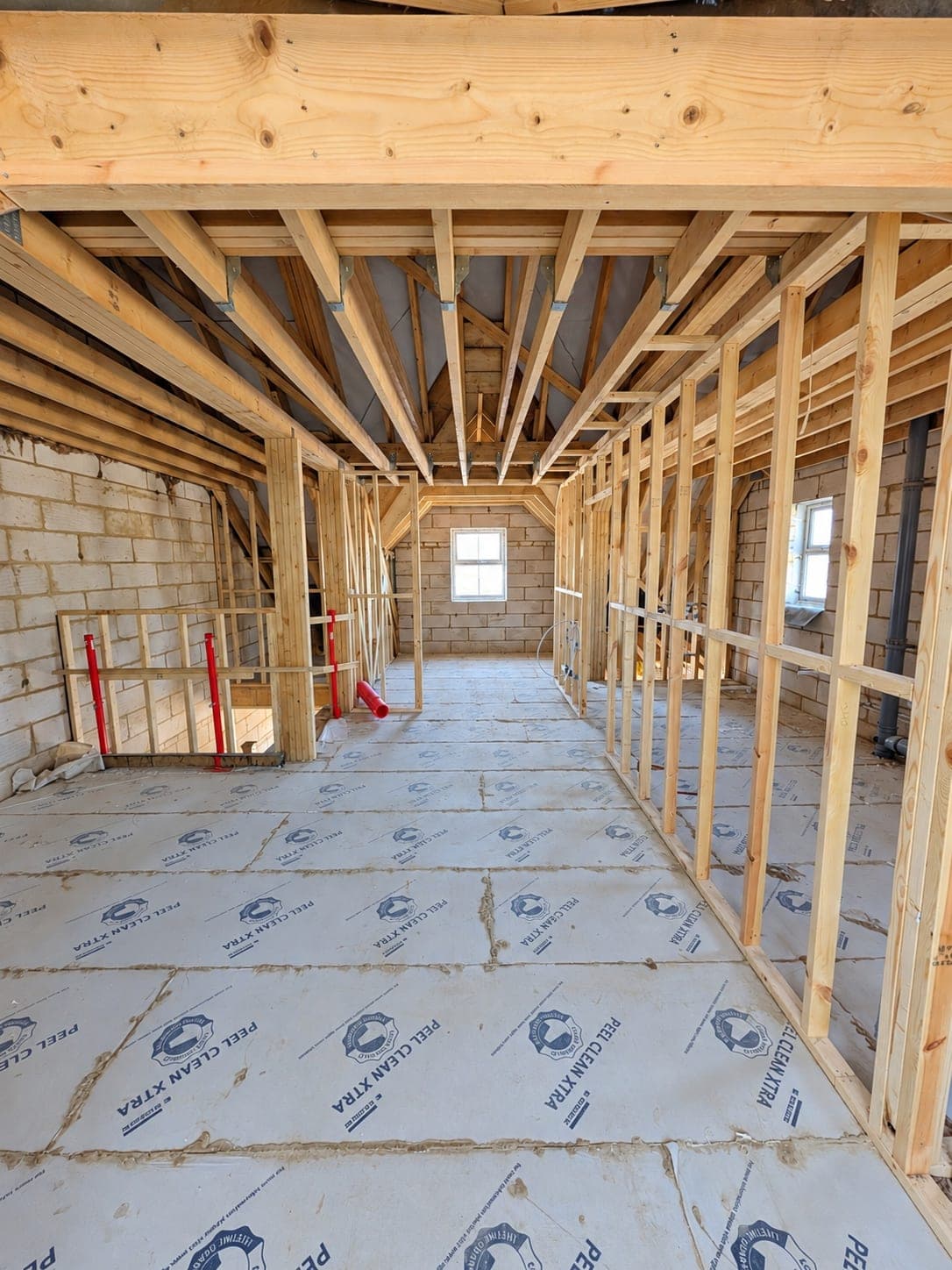 Boarded corridor partitions with door openings formed, London
