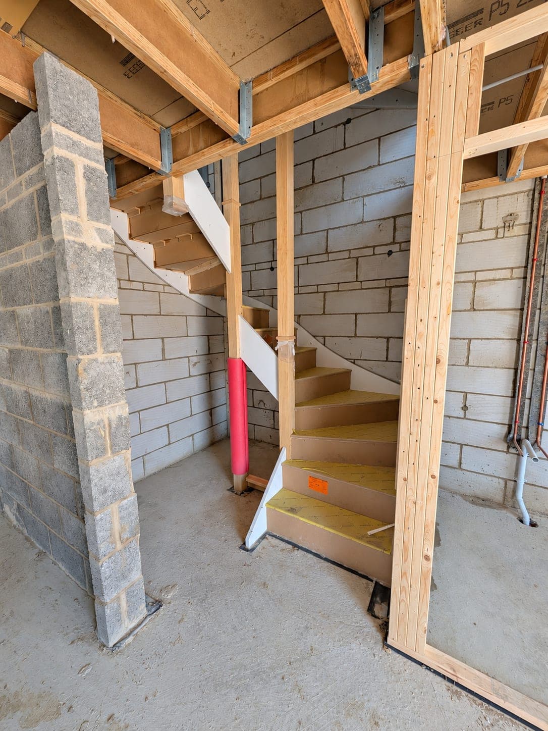 Stud framing carried around a stairwell, London