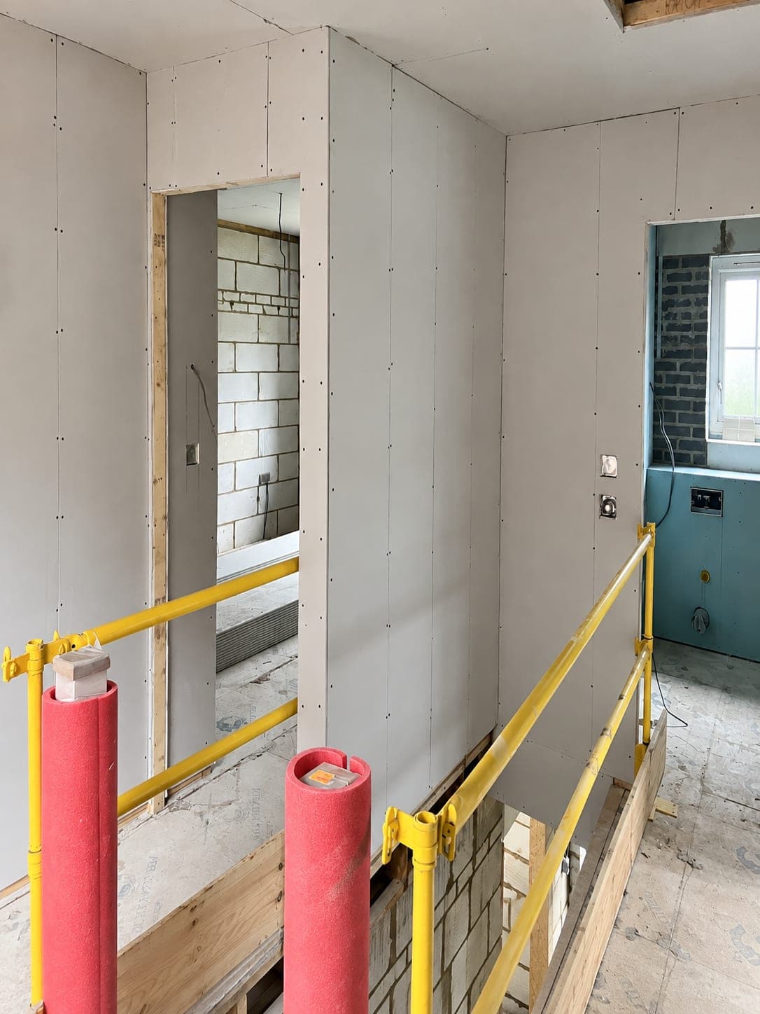 Pipework boxed in behind boarded partitions, London