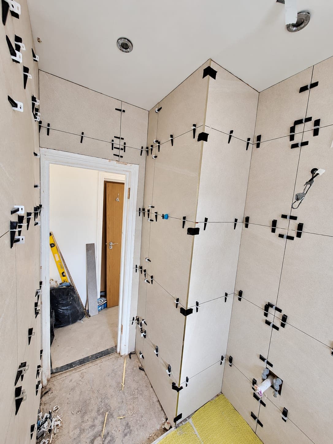 Decoupling matting laid over the floor before tiling, London
