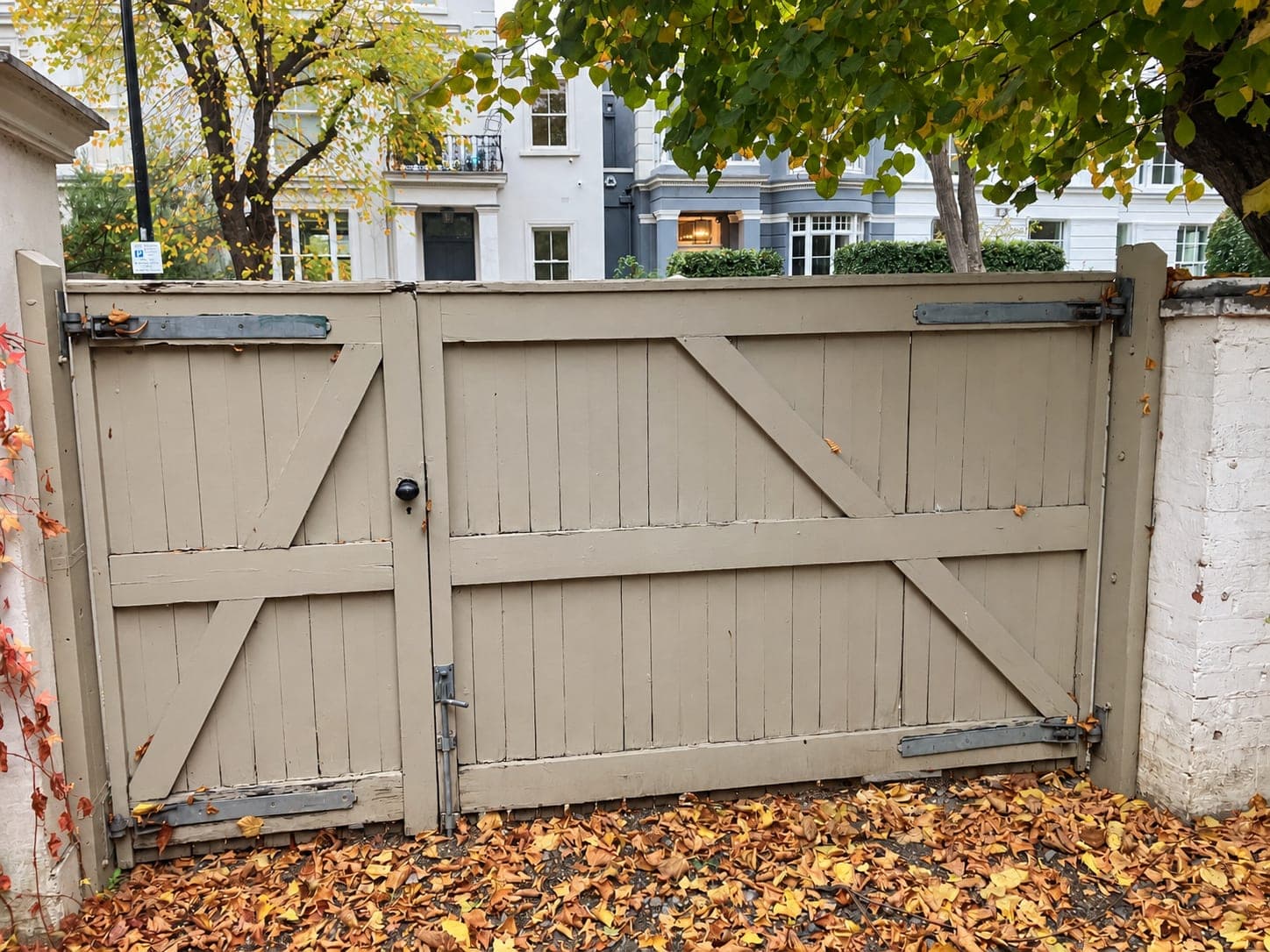 Braced timber frame on the back face of a pair of gates, London